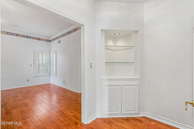 a bathroom with a double vanity sink and mirror