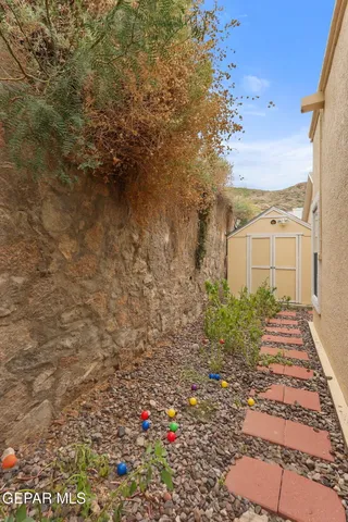 a view of a patio with couches table and chairs and potted plants