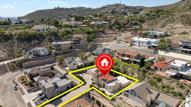 an aerial view of a red and white house