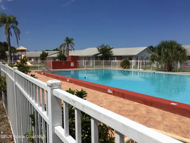 a view of swimming pool with outdoor space and seating area
