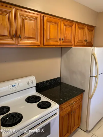 a kitchen with a stove and a microwave