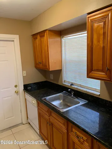 a bathroom with a sink a mirror and cabinets