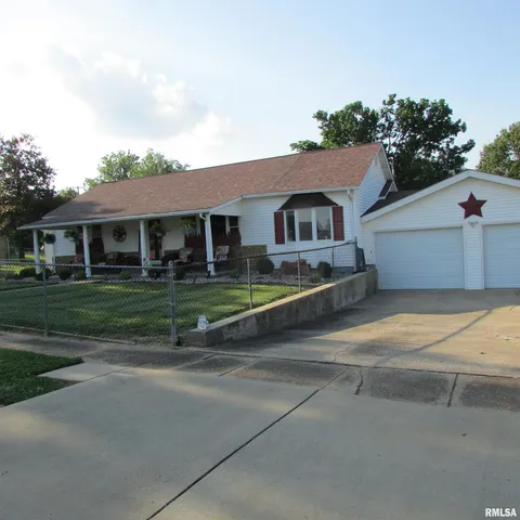 a view of house with outdoor space and parking