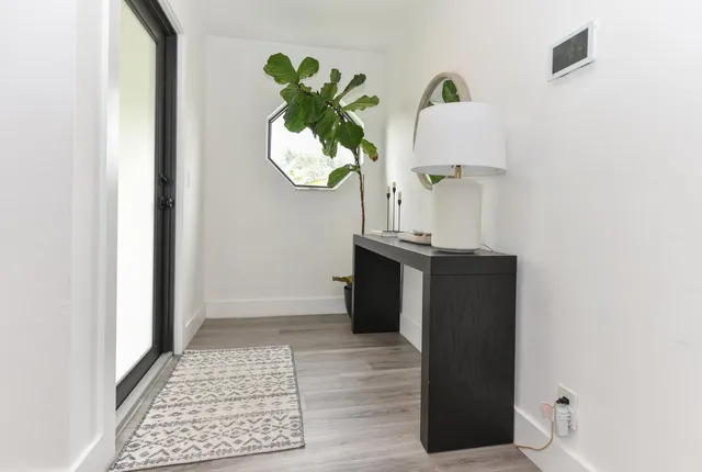 an entryway with wooden floor