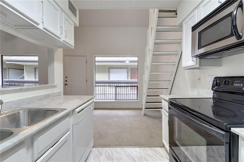908 Poplar Street, Unit 204 Austin, TX 78705 - Photo 9 of 15 a kitchen with a sink and a stove top oven