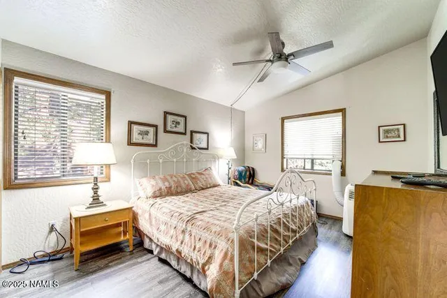 a bedroom with a large bed and a window