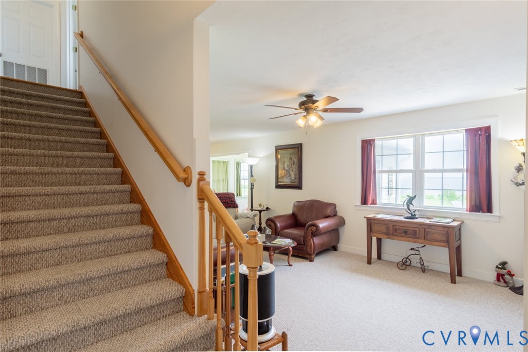 617 Sheepside Road Laneview, VA 22504 - Photo 27 of 33 Carpeted staircase with wood-finish handrails and