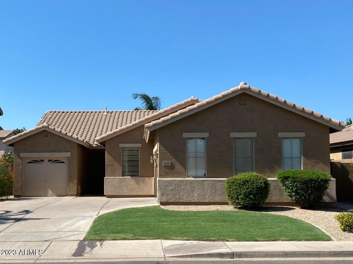 232 West Hawk Way Chandler, AZ 85286 - Photo 1 of 16 a front view of a house with a garden and yard