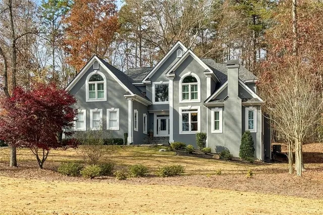 a front view of a house with a yard