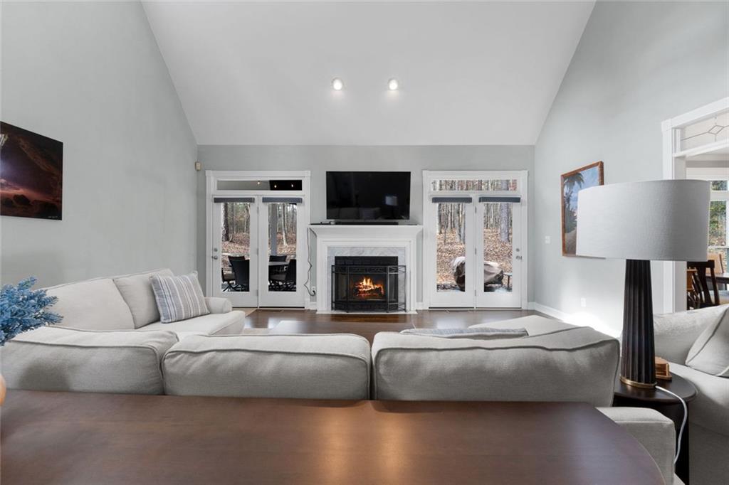 295 Springwater Chase Newnan, GA 30265 - Photo 12 of 68 a living room with fireplace furniture and a flat screen tv