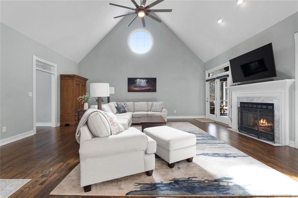 295 Springwater Chase Newnan, GA 30265 - Photo 13 of 68 a living room with furniture and a fireplace