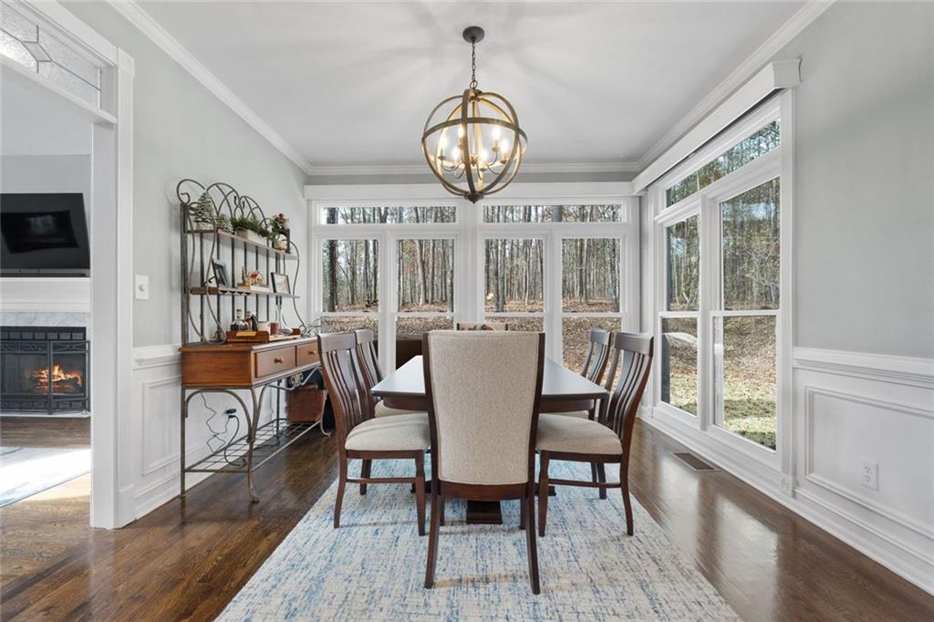 295 Springwater Chase Newnan, GA 30265 - Photo 15 of 68 a view of a dining room with furniture window and wooden floor