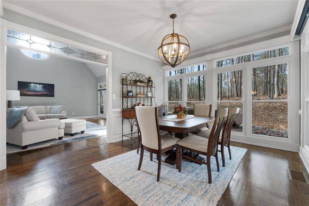 295 Springwater Chase Newnan, GA 30265 - Photo 16 of 68 a view of a dining room with furniture window and wooden floor