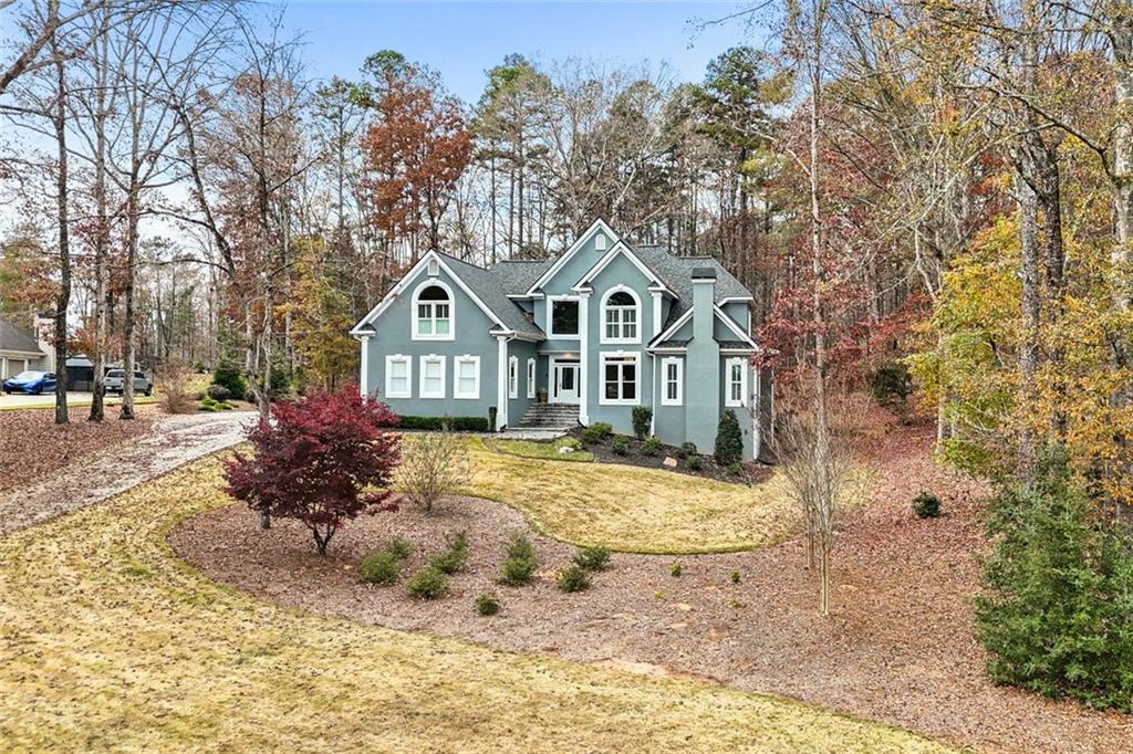 295 Springwater Chase Newnan, GA 30265 - Photo 2 of 68 a front view of a house with a yard