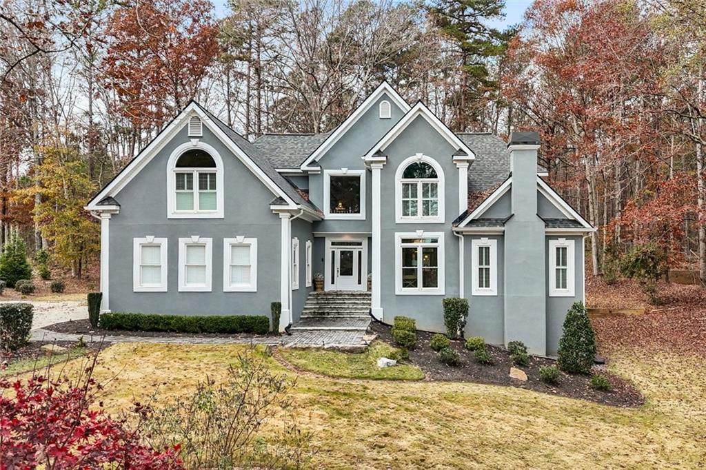 295 Springwater Chase Newnan, GA 30265 - Photo 3 of 68 a front view of a house with a yard
