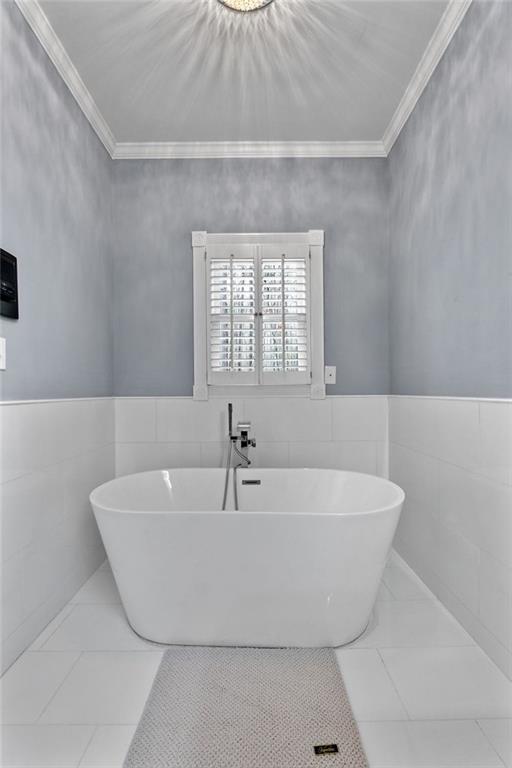 295 Springwater Chase Newnan, GA 30265 - Photo 34 of 68 a white bath tub sitting in a bathroom