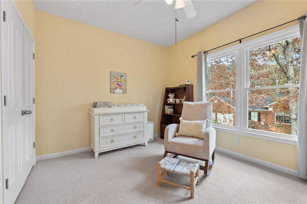 295 Springwater Chase Newnan, GA 30265 - Photo 45 of 68 a bedroom with a bed and a window