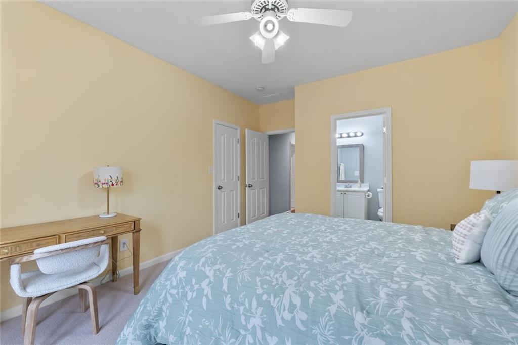 295 Springwater Chase Newnan, GA 30265 - Photo 47 of 68 a bedroom with a bed and a chair