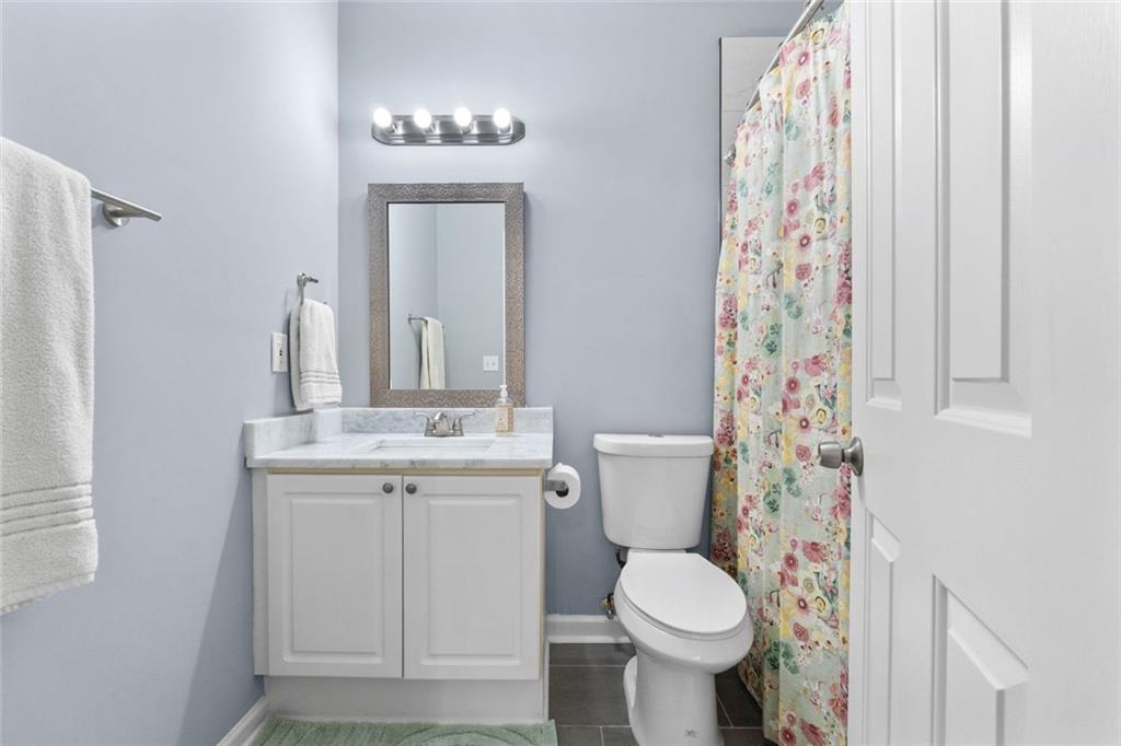 295 Springwater Chase Newnan, GA 30265 - Photo 48 of 68 a bathroom with a sink toilet and shower