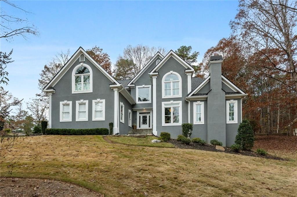 295 Springwater Chase Newnan, GA 30265 - Photo 5 of 68 a front view of a house with a yard