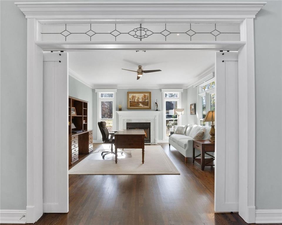 295 Springwater Chase Newnan, GA 30265 - Photo 9 of 68 a living room with furniture and a fireplace