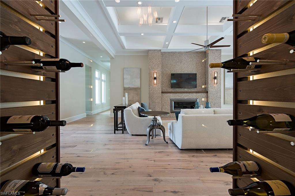 625 Rudder Road Naples, FL 34102 - Photo 6 of 19 a living room with furniture and a flat screen tv