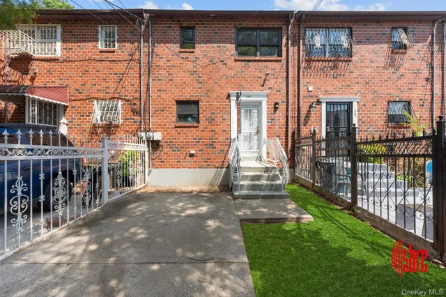 a view of a brick house with a large windows