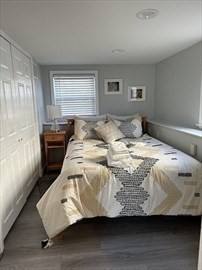 34 Brookline Avenue Hull, MA 02045 - Photo 16 of 18 a bedroom with a bed and wooden floor