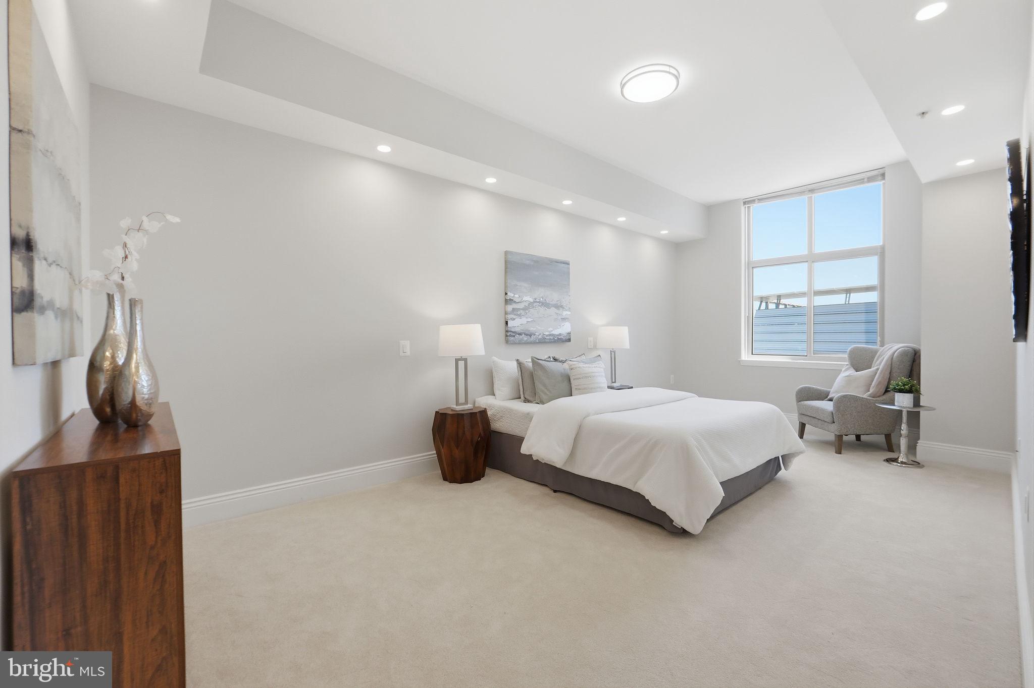 11990 Market Street, Unit 2103 Reston, VA 20190 - Photo 43 of 78 Serene modern bedroom with natural light.