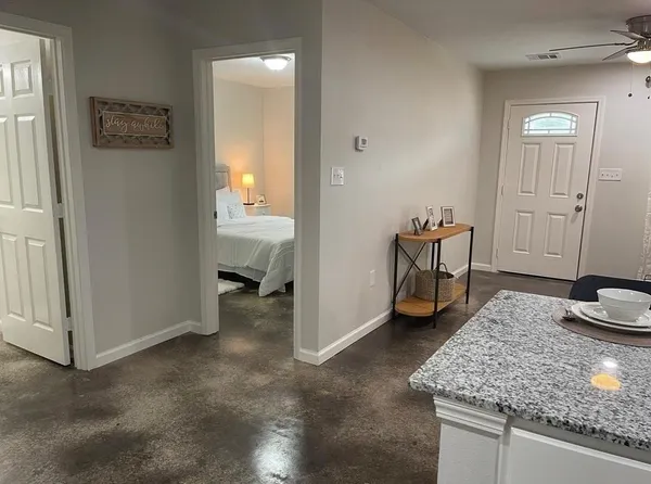 a bedroom with a bed and a window