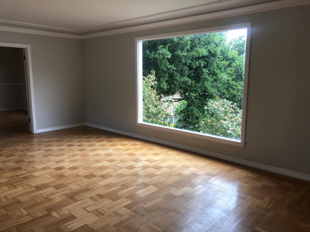 130 El Bonito Way Millbrae, CA 94030 - Photo 12 of 48 a view of an empty room with wooden floor and a window