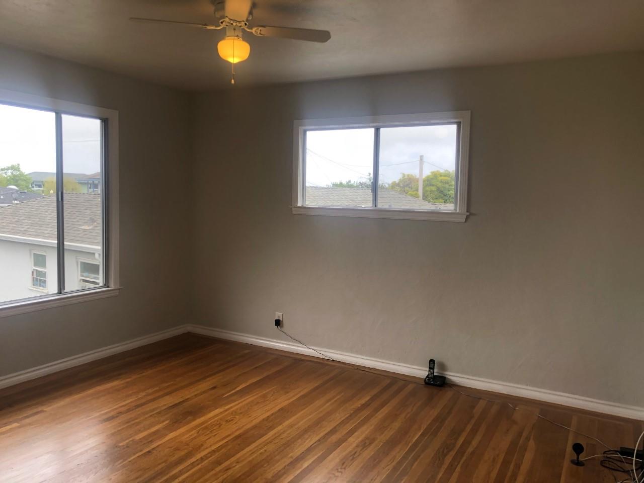 130 El Bonito Way Millbrae, CA 94030 - Photo 15 of 48 an empty room with wooden floor and windows