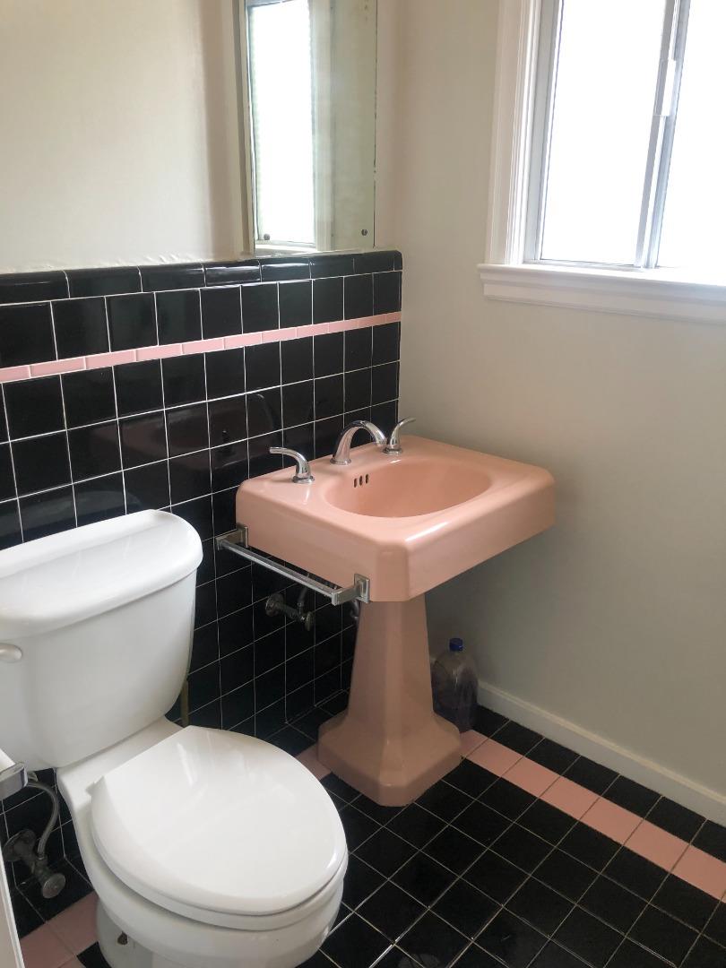 130 El Bonito Way Millbrae, CA 94030 - Photo 16 of 48 a bathroom with a sink toilet and window