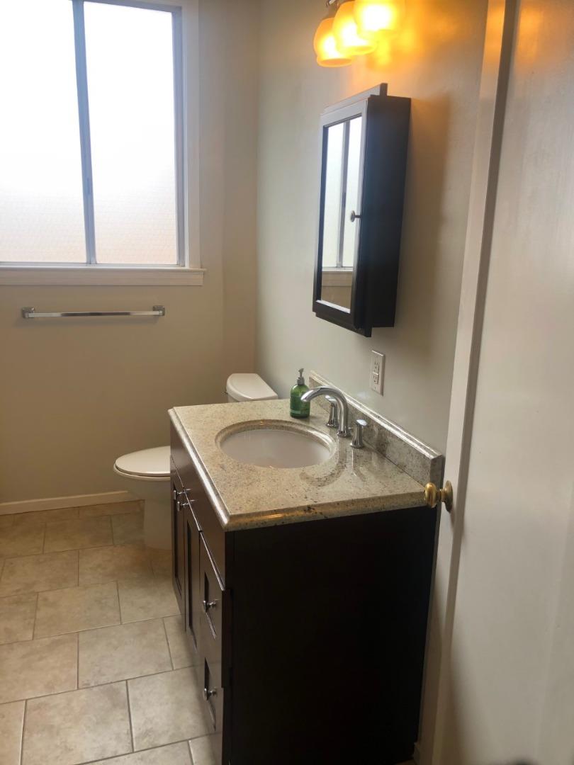 130 El Bonito Way Millbrae, CA 94030 - Photo 23 of 48 a bathroom with a toilet sink and mirror