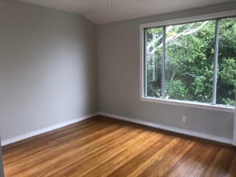 130 El Bonito Way Millbrae, CA 94030 - Photo 24 of 48 a view of an empty room with wooden floor and a window
