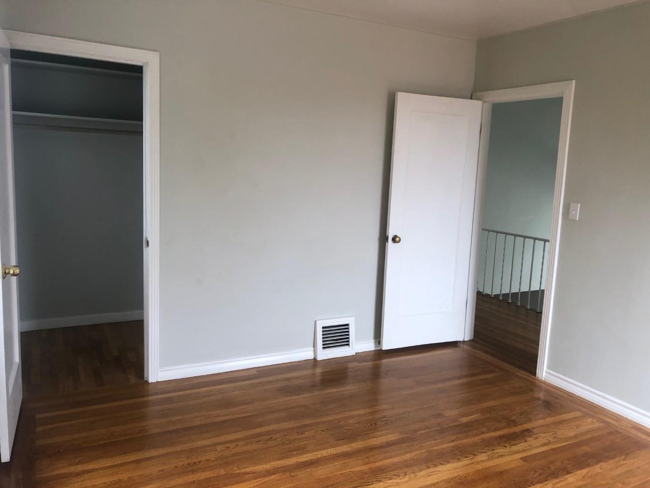 130 El Bonito Way Millbrae, CA 94030 - Photo 25 of 48 an empty room with wooden floor and closet