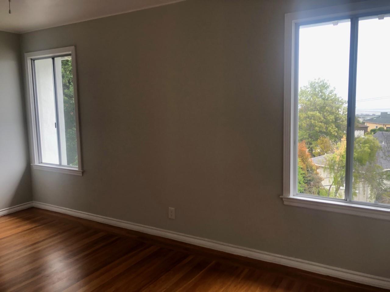 130 El Bonito Way Millbrae, CA 94030 - Photo 28 of 48 an empty room with wooden floor and windows