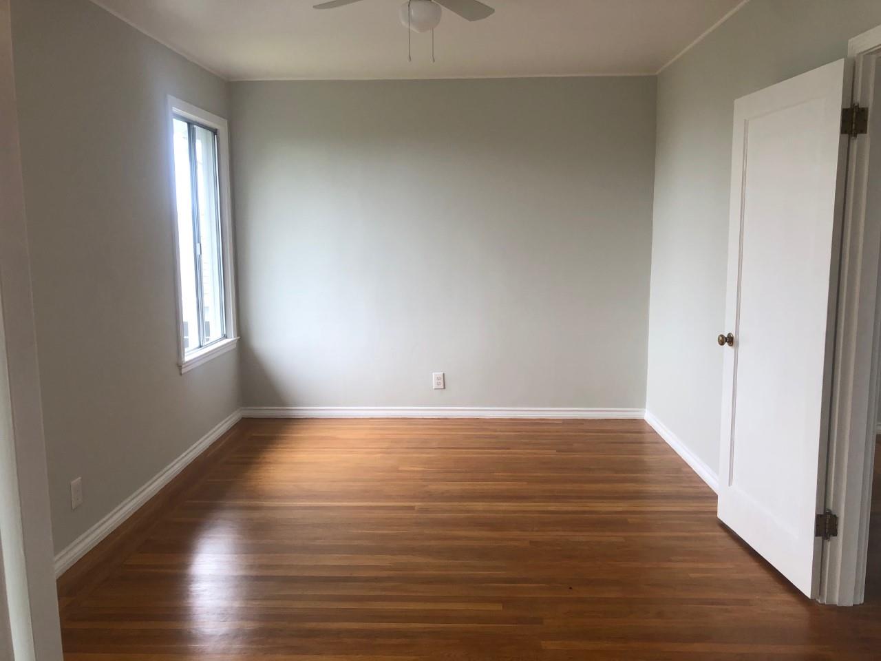 130 El Bonito Way Millbrae, CA 94030 - Photo 30 of 48 a view of an empty room with wooden floor and a window