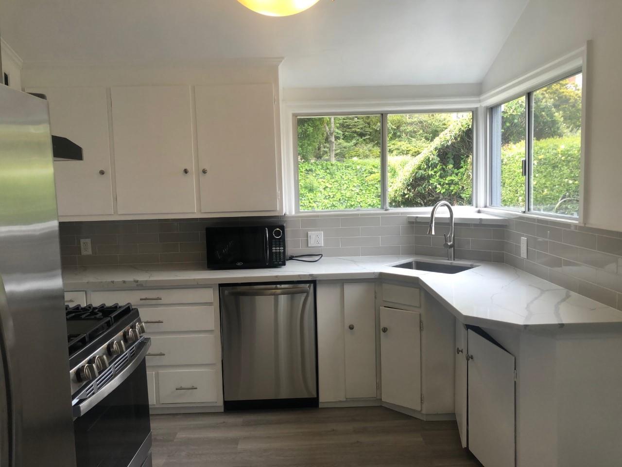 130 El Bonito Way Millbrae, CA 94030 - Photo 4 of 48 a kitchen with a sink and a window