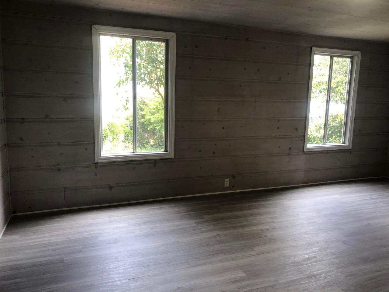 130 El Bonito Way Millbrae, CA 94030 - Photo 43 of 48 an empty room with wooden floor and windows