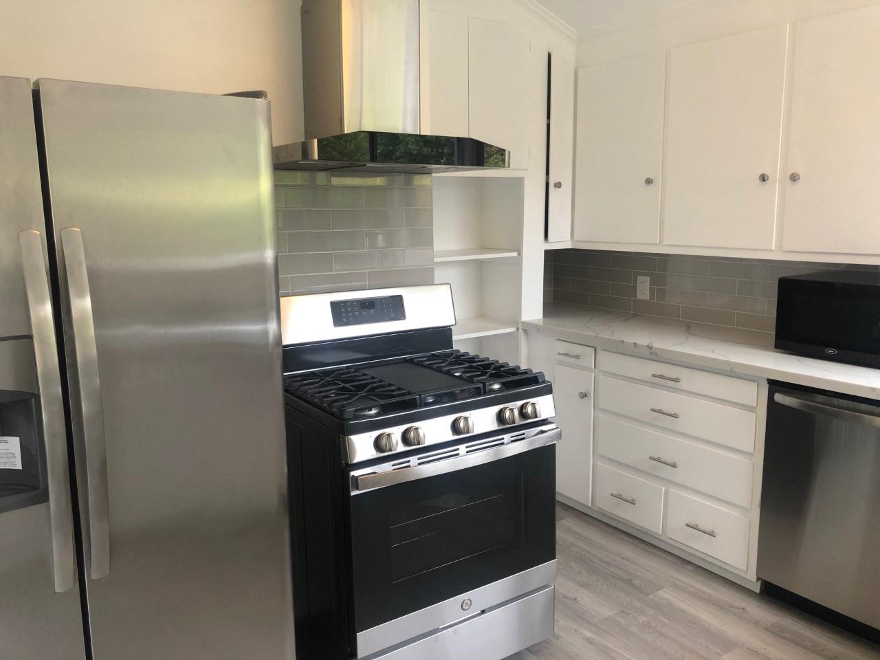 130 El Bonito Way Millbrae, CA 94030 - Photo 5 of 48 a stove top oven sitting inside of a kitchen