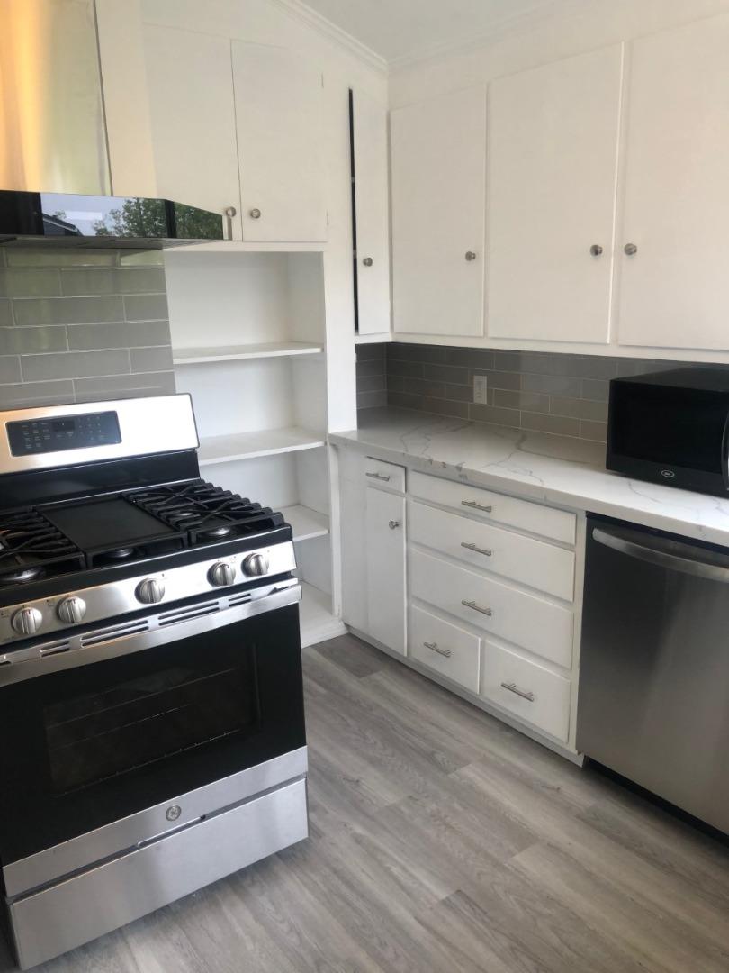 130 El Bonito Way Millbrae, CA 94030 - Photo 6 of 48 a stove top oven sitting inside of a kitchen