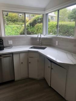 130 El Bonito Way Millbrae, CA 94030 - Photo 7 of 48 a kitchen with a sink and large window