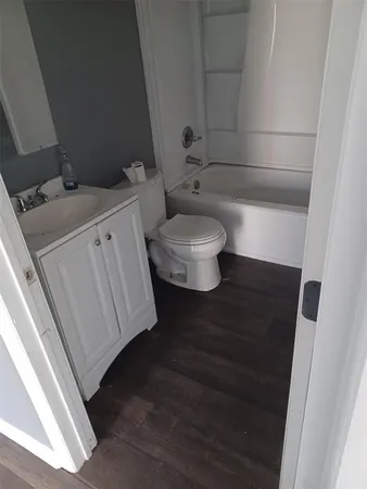 a bathroom with a toilet and a sink