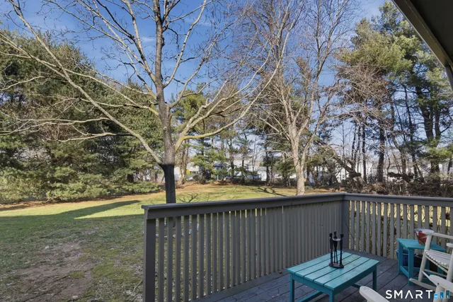 a view of a bench in backyard of house