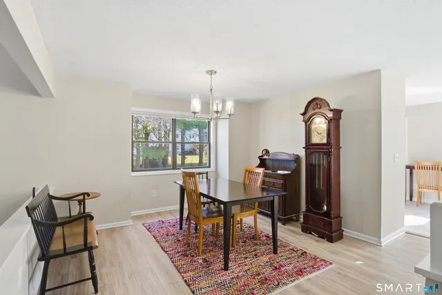 a view of a dining room with furniture and window