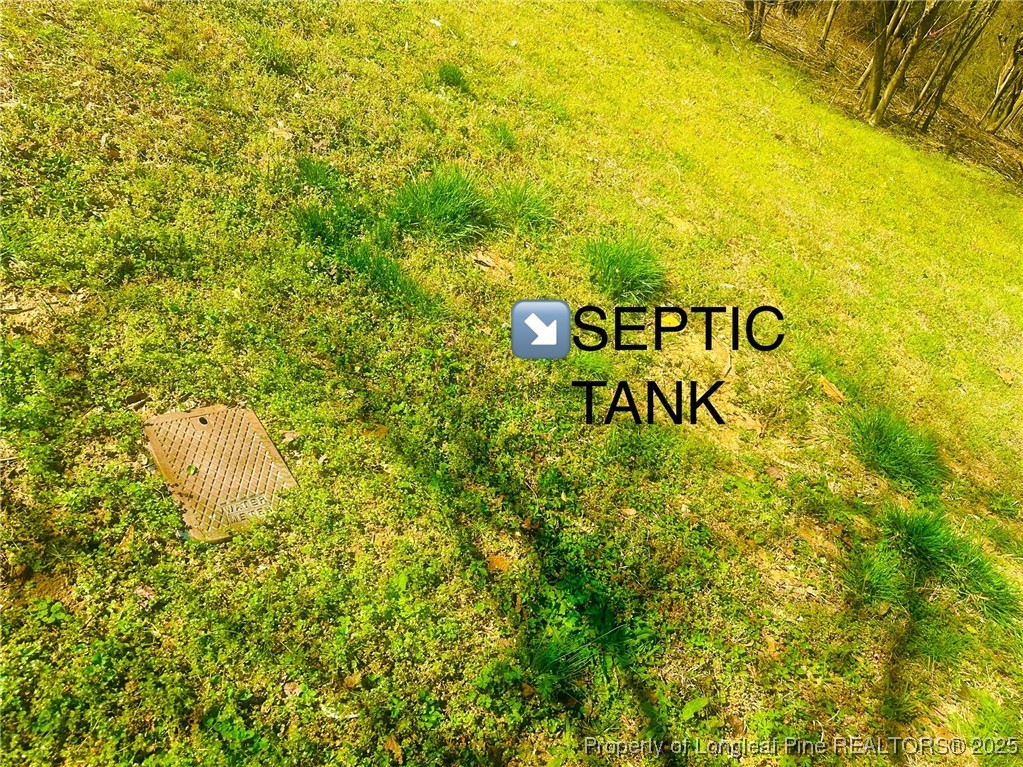 33 Alberta Lane Cameron, NC 28326 - Photo 11 of 14 a sign of golf club on a wall