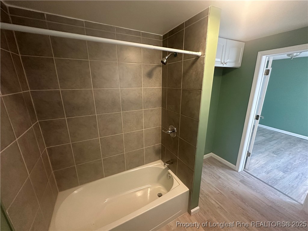 33 Alberta Lane Cameron, NC 28326 - Photo 9 of 14 a bathroom with a bathtub and a shower