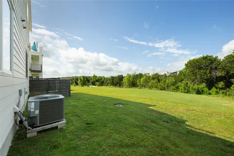 a view of a green field with sitting area