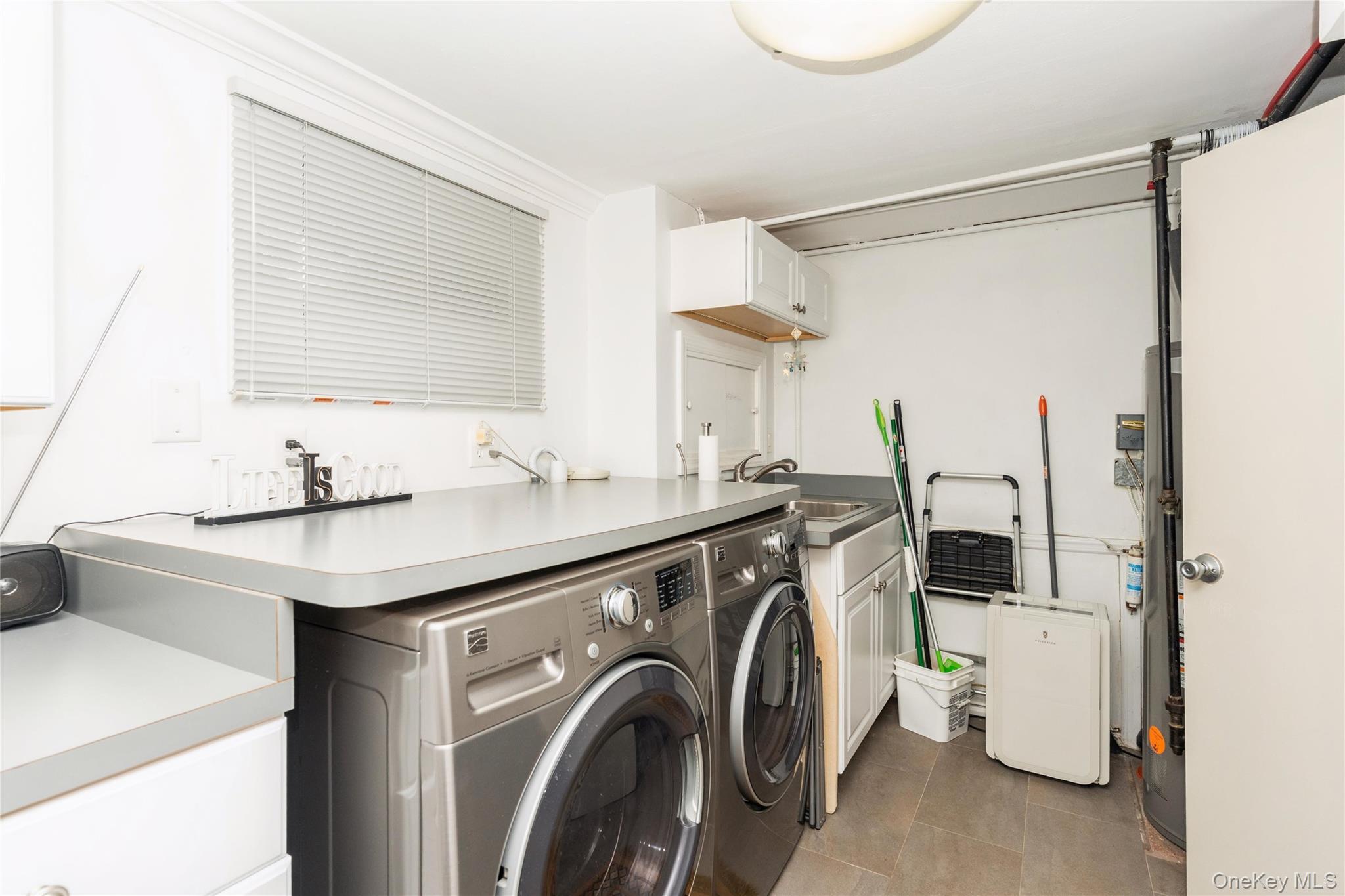 2772 Riverside Avenue Merrick, NY 11566 - Photo 21 of 45 a utility room with dryer and washer
